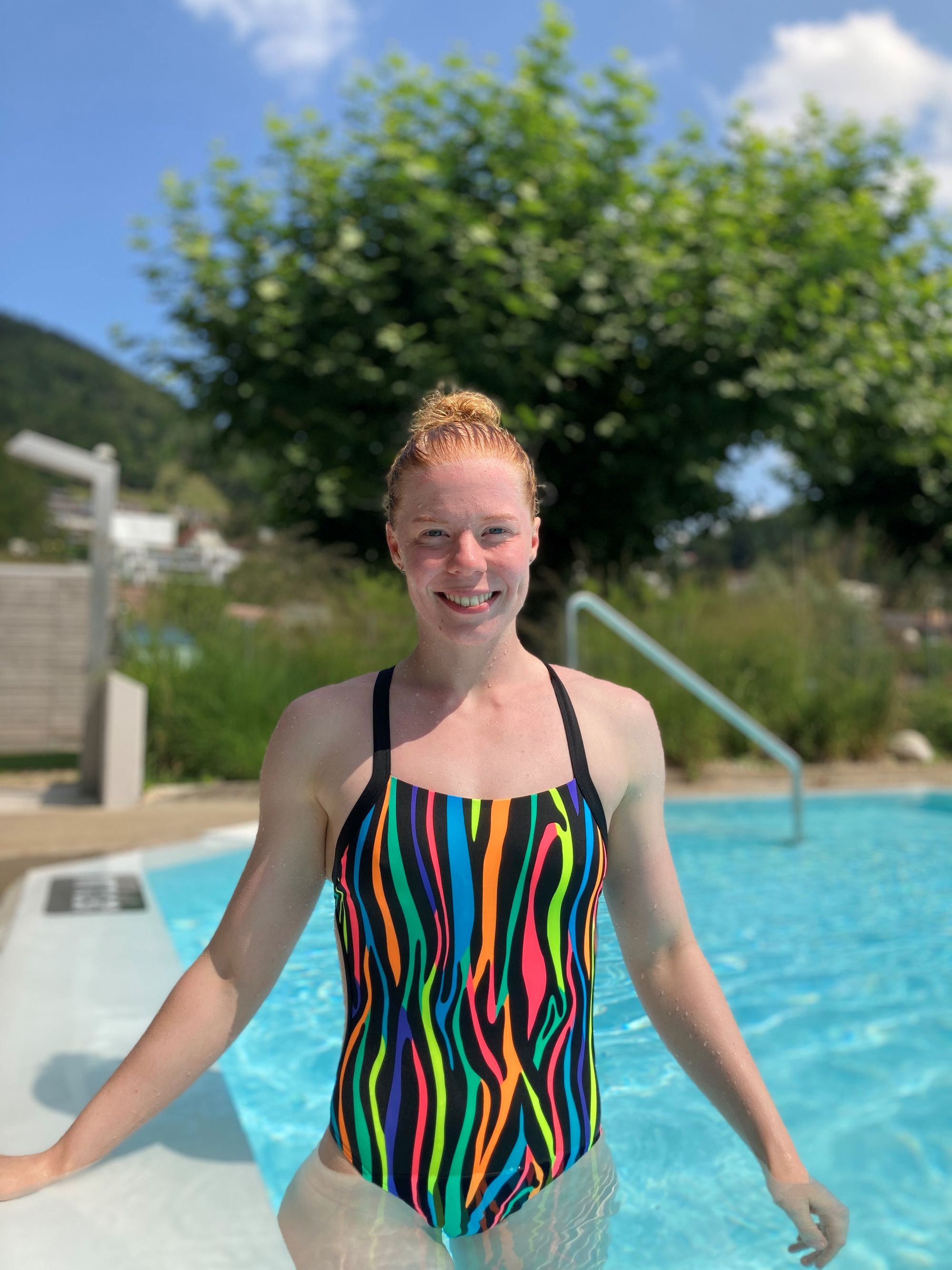 swimmer in the pool looking at camera