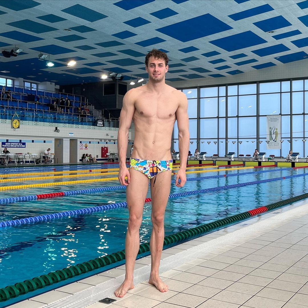 swimmer standing on pool deck