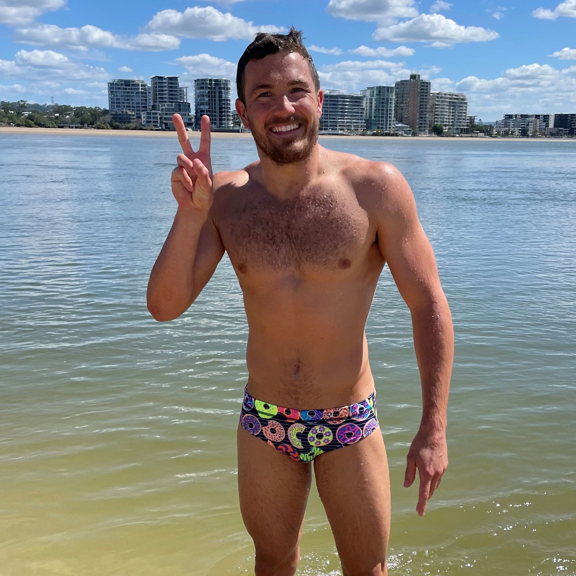 swimmer making peace sign